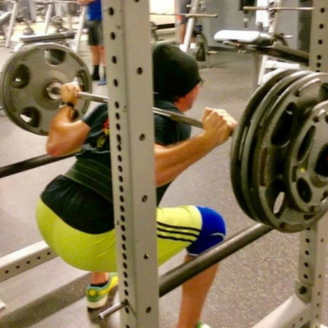 Member squatting in a rack