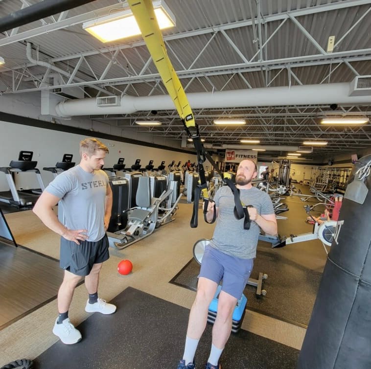 Two people training together at LIV Fitness